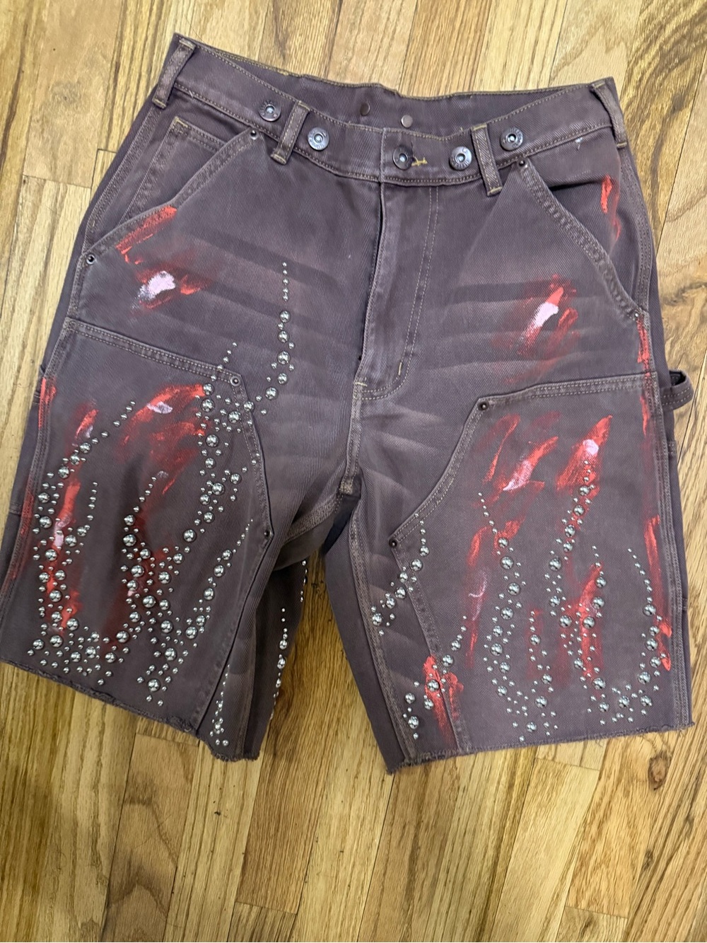 Men's Brown Cargo Shorts with Red Paint Accents and Stud Detailing